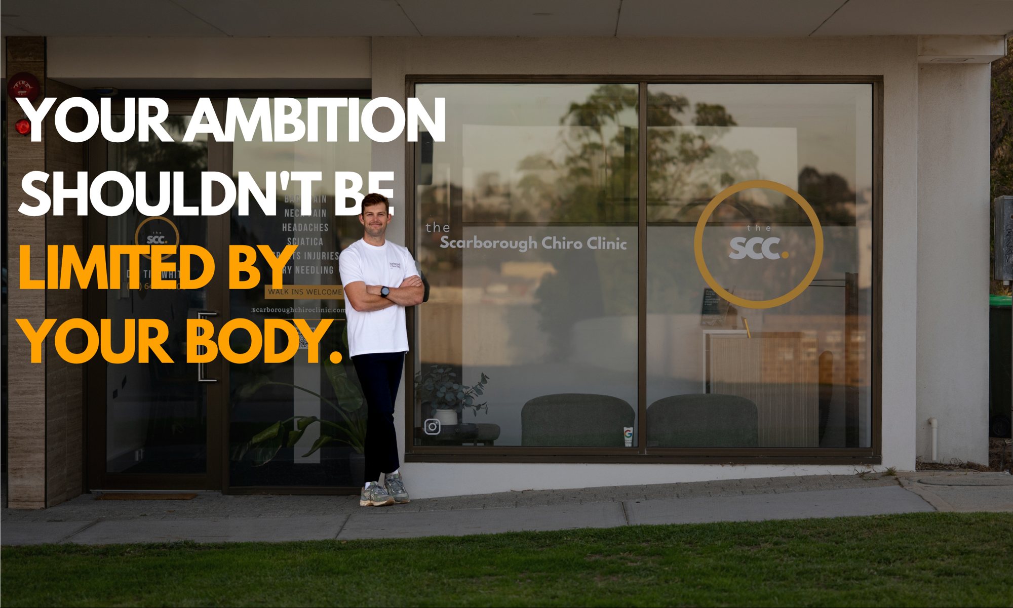 Tim White outside Scarborough Chiro Clinic with the words: Your ambition shouldn't be limited by your body.