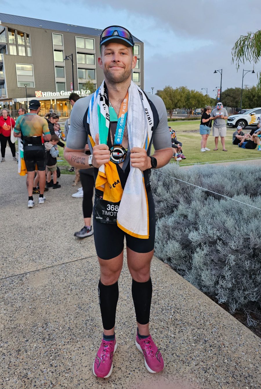 Tim at an Ironman finish line