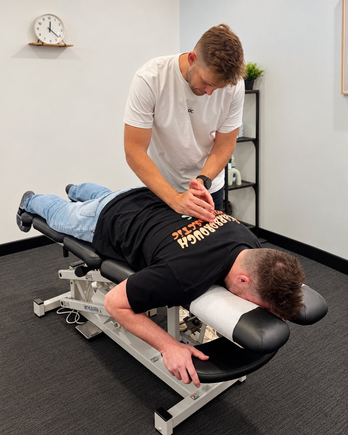 Tim treating a patient's lower back